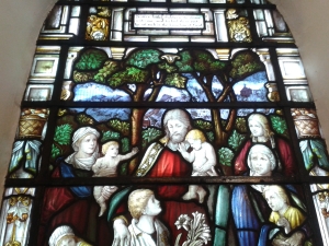 The Victorian stained glass window featuring the picture of the chapel